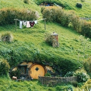 turfed roofs and green hills