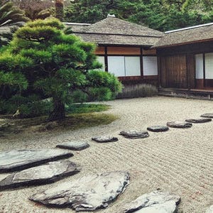 raked gravel in a Japanese temple garden raked gravel in a temple garden
